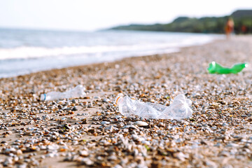 Empty plastic bottles on the beach,. Problem of global plastic pollution of the Earth.