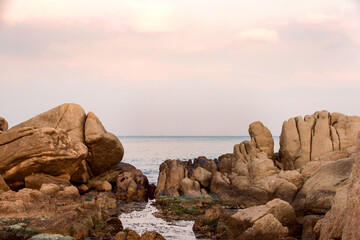 Beautiful rock and waves on the seashore along the coastline.