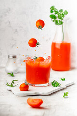 
tomato juice with parsley and fresh tomatoes
