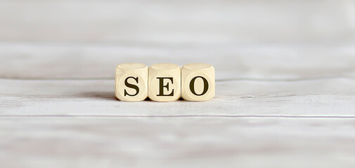 Seo word collected of wooden elements on wooden background