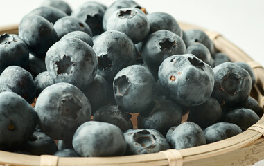 Delicious fresh blueberries in the basket, selective focus.