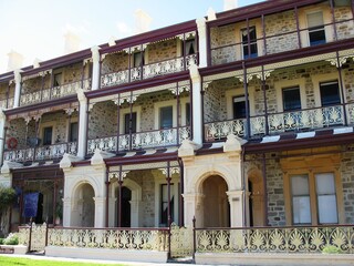 Fototapeta na wymiar Victorian bluestone and sandstone three story terrace houses in adelaide