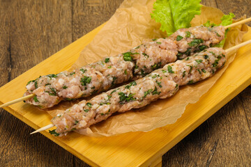 Raw minced pork skewer kebab for grill