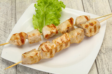 Grilled pork skewer served salad