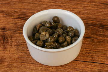Tasty capers in the bowl