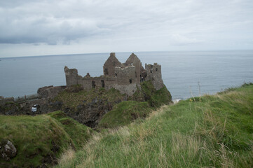 Fototapeta na wymiar Ruins of an old castle on the seafront of Northern Ireland.