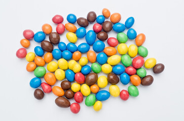 Colored candies filled with chocolate. On white background