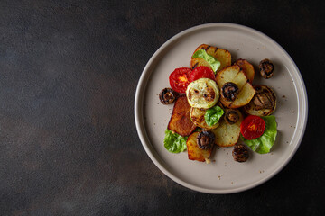 Grilled vegetables and mushrooms on a dark background, free space.