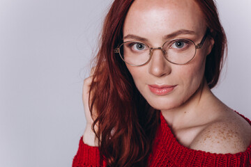 Fototapeta premium Beautiful woman natural face in eye glasses freckles casual female portrait lifestyle beauty girl