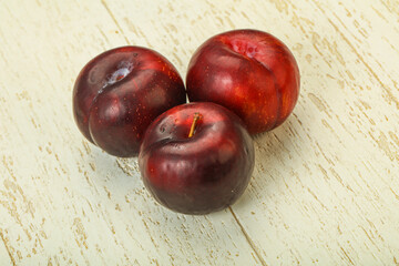 Ripe sweet plum fruit heap