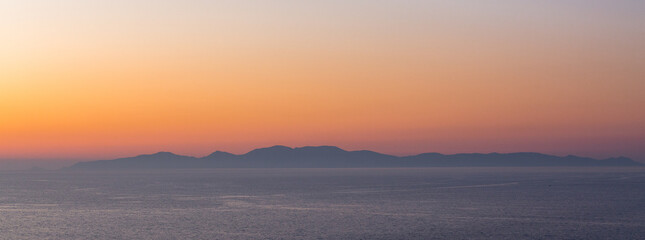 Fototapeta na wymiar sunset with yachts on santorini island
