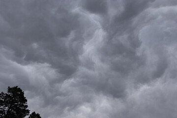 Grey storm clouds swirling in the sky. 