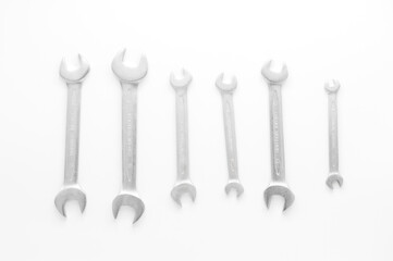 Chrome-Vanadium Wrenches of Different Sizes. Heap Of Stainless Steel Spanners Of Different Sizes Isolated On White Background.