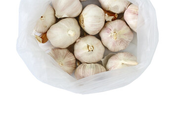 garlics in plastic bag on isolated white background 
