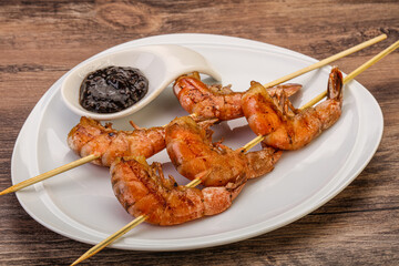 Grilled prawn skewer with pepper sauce