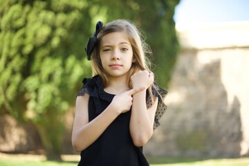 Beautiful young Caucasian woman over isolated background In hurry pointing to watch time,...