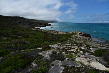 Fototapeta na wymiar An unspoilt landscape of green and blue near L'Agulhas, where the Indian and Atlantic Oceans meet