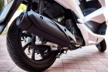 Close-up detail of a motorcycle exhaust pipe.