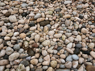 Pebble texture. Stone background. Rocky beach. Sea stones texture