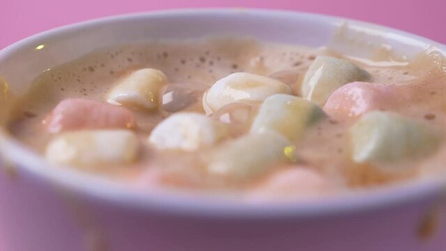 Close up marshmallow falling into cup with hot chocolate cocoa drink dessert tasty sugar sweet food cafe delicious cook beverage, coffee slow motion