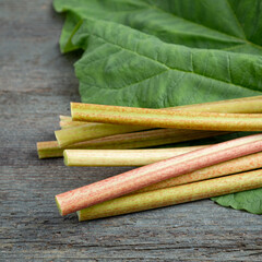 Rhubarb on a wooden table. Making of rhubarb