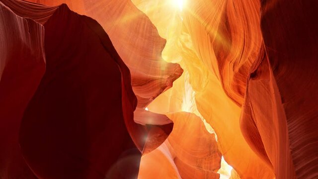 Various red and orange rocks in antelope canyon. Midday sun hits the antelope canyon whimsically illuminating canyon walls. Red walls of Antelope Canyon in Arizona, USA, United States