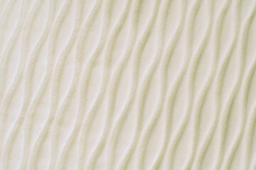 Fototapeta na wymiar Soft blurred white rib waves fabric texture background.