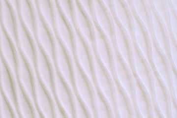 Soft blurred white rib waves fabric texture background.