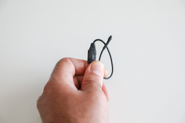 July 31, 2020: bug is held between the fingers of one hand by a technician specialized in...