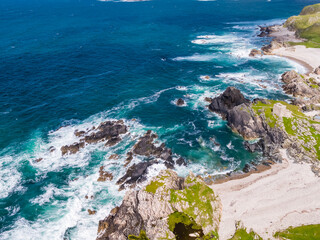 Aerial view of the beautiful coast next to Carrickabraghy Castle - Isle of Doagh, Inishowen, County Donegal - Ireland