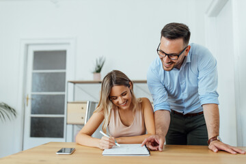 Obraz premium People, learning and education. handsome tutor with college student.