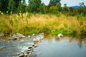 Boulders forms a mini waterfall on Tongariro River