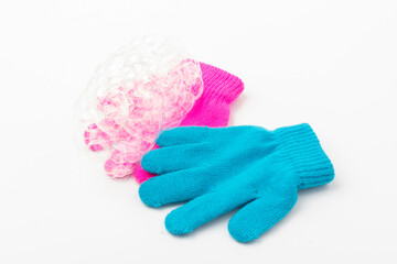 Child  brighte gloves whith soap bubble on white background.