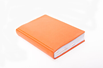 Orange notepad with bookmarks on white background