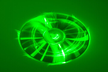 Compact disk under green laser beam