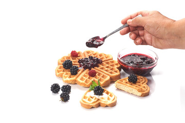 Girl served waffles with blueberry jam, Breakfast with coffee. White background, top view, close up