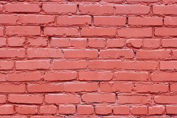 Obraz premium Red brick wall, background with copy space. Old bricks painted in red color, texture background. Facade wall.