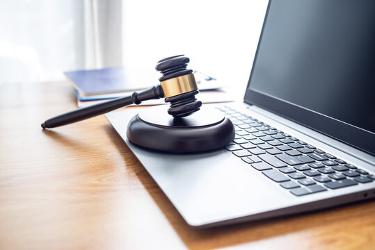 Auction hammer on a laptop, online auction concept illustration