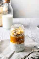 delicious dessert for breakfast. Yogurt with chia seeds, apricot puree and granola