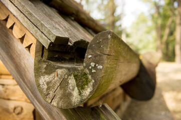 Part of a historic dwelling, carved underlayment, roof and under-roof gutter in a 17th century wooden hut