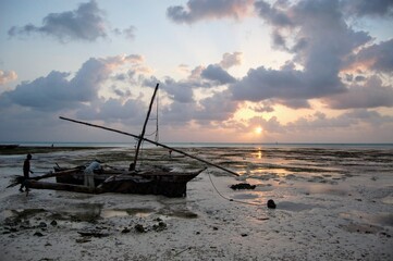 Fishermen preparing their boat at sunrise in Jambiani, Zanzibar