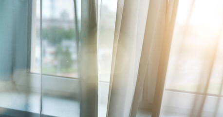 Naklejka na ściany i meble transparent curtains at blurry plastic windows back sunlight