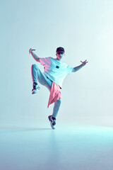 Fototapeta na wymiar Boy dancing contemporary dance in studio. Breakdancing.