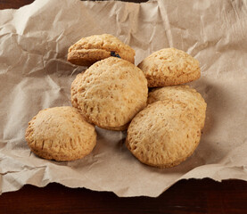 homemade round baked cookies on brown paper, delicious dessert