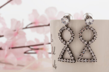 Close up of diamond earrings. space for your text.