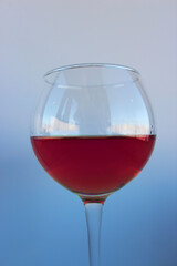 A glass of wine on a white background