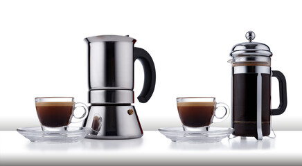 Two different styles of coffee making pot, and expresso cup and saucer full of smooth expresso...
