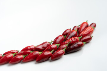 Red chillies on an isolated white background with shallow depth of field