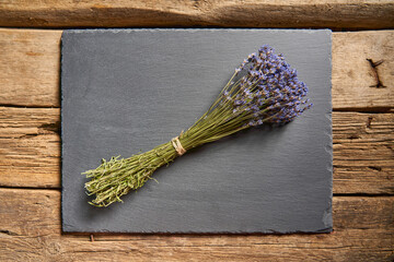 A bunch of lavender flowers on wooden planks