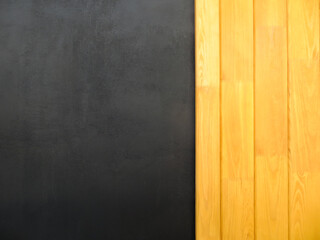 Black and yellow background of wood and plaster